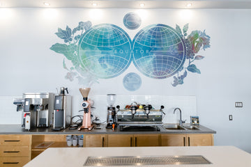 The cupping lab at Equator Coffee Roasters in Almonte. Coffee brewer, grinder and espresso machine are on the back counter.