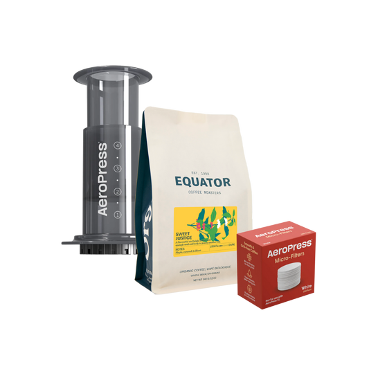 AeroPress coffeemaker with a bag of Sweet Justice and a box of filters.