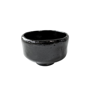 Black Kuro Raku matcha bowl that was made in Japan.