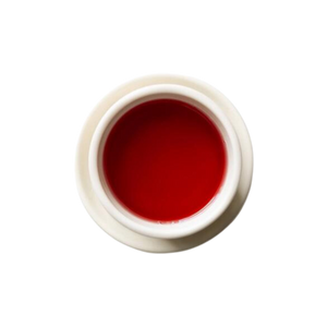 Cup of steeped blueberry hibiscus tea.