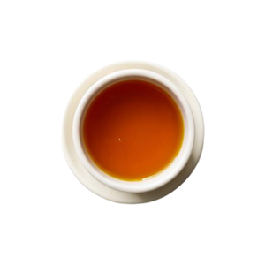 Cup of steeped turmeric ginger tea