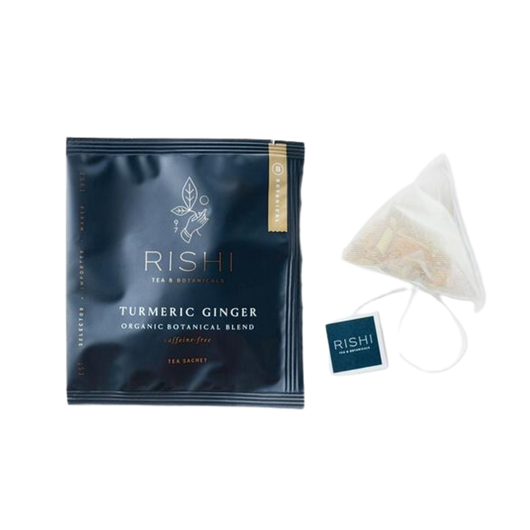 Package of Rishi organic turmeric ginger tea and tea bag.