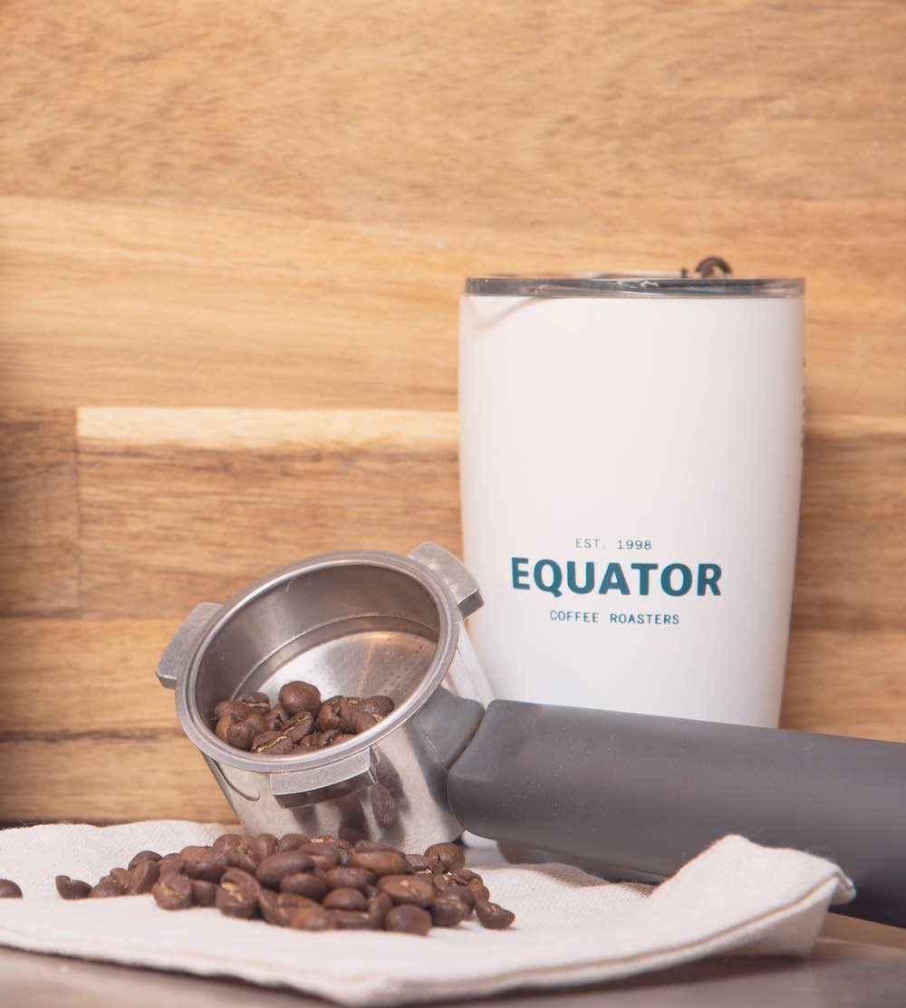 
                  
                  Load image into Gallery viewer, Coffee beans and the Equator 12 oz Miir tumbler.
                  
                  